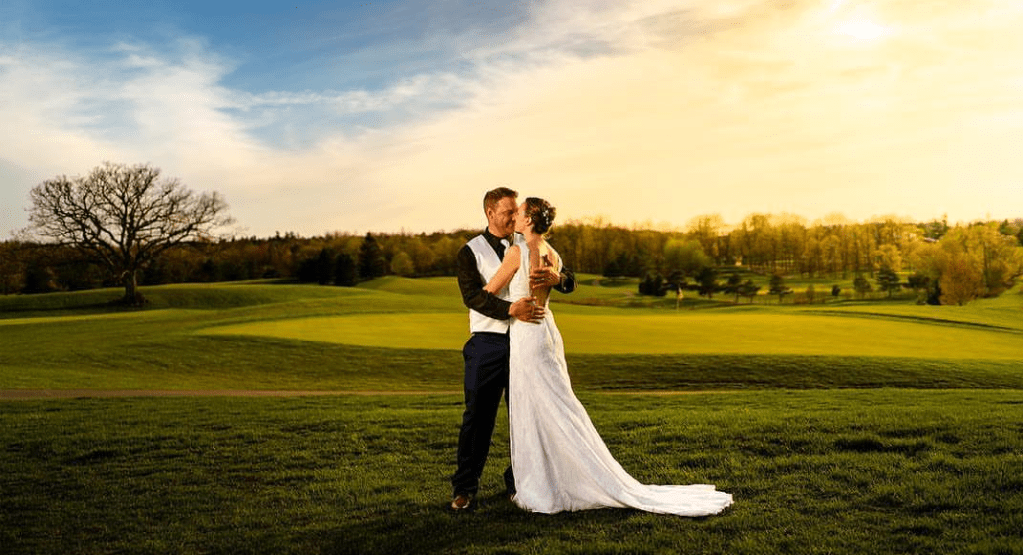 Bride and groom on golf course